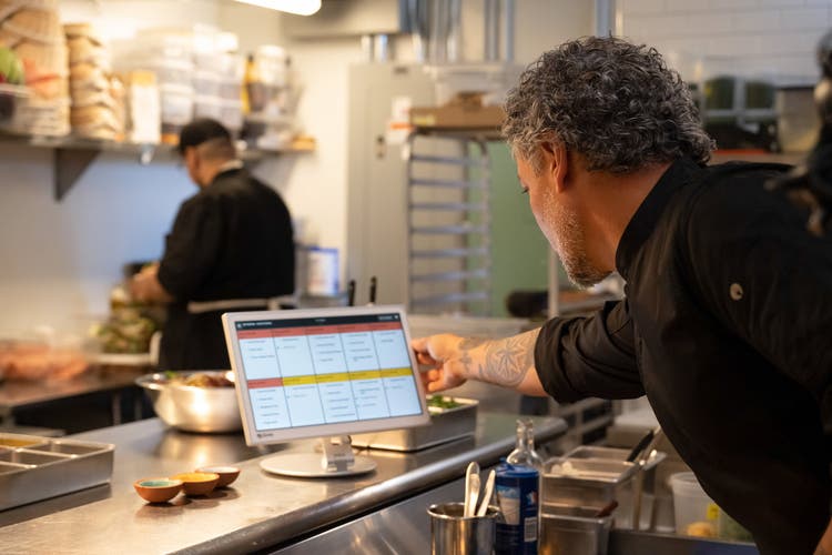 man in full service kitchen