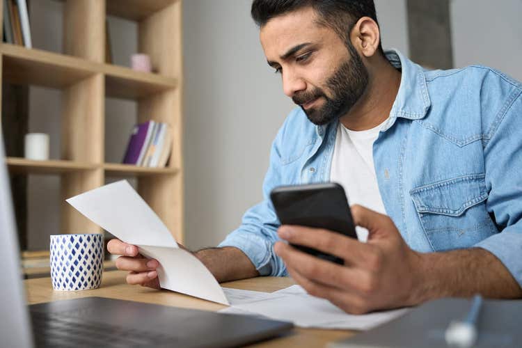 Clover small business owner calculating taxes