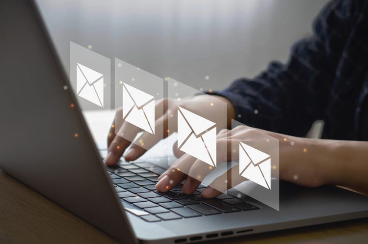 person writing emails
