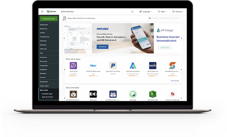 Black laptop with Clover App Market screen.