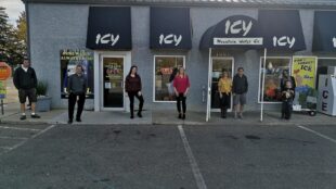 People standing outside Icy Mountain Water storefront