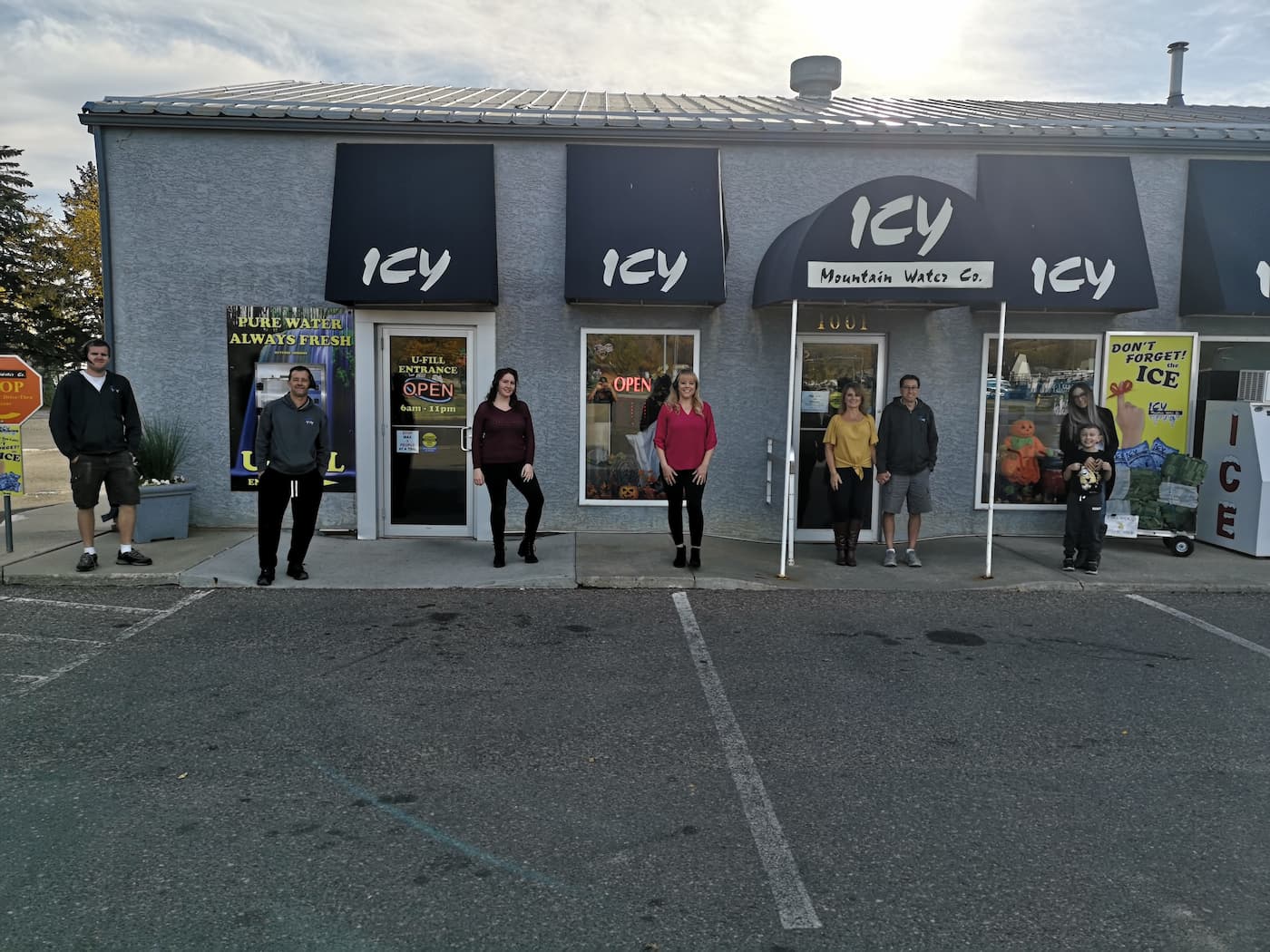People standing outside Icy Mountain Water storefront
