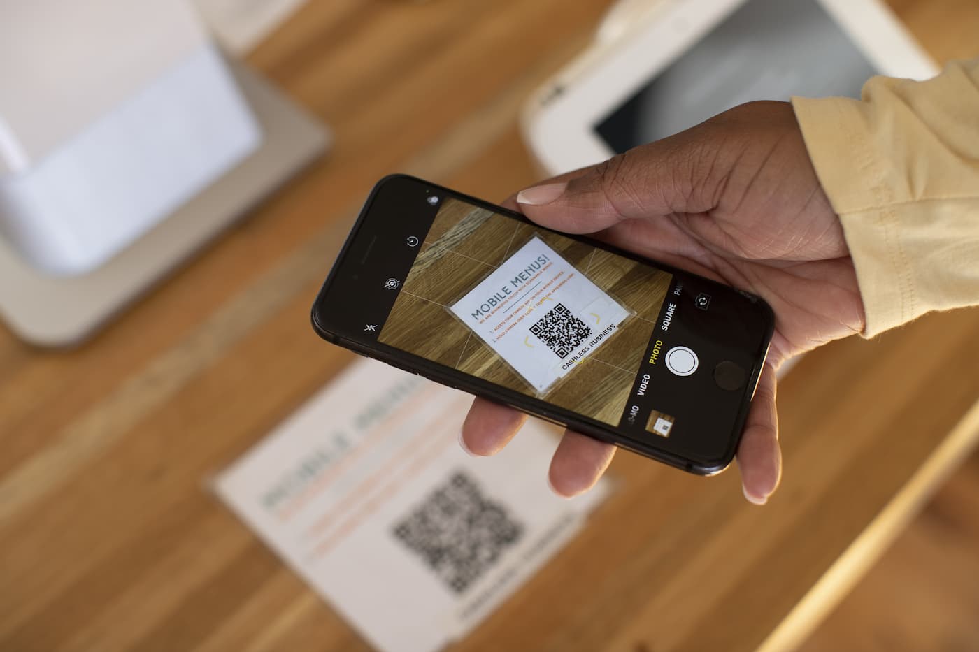 Person scanning a QR code with a smart phone