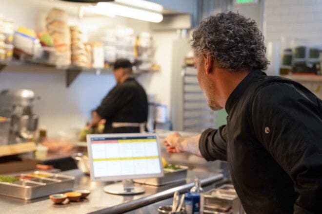 Chef looking at KDS system
