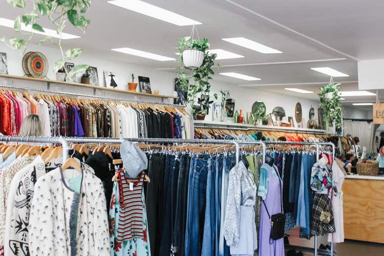 Racks of clothes inside a shop
