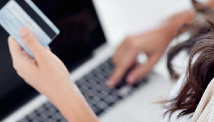 Woman holding credit card