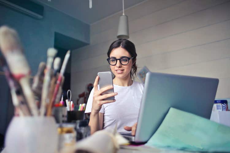 Gen Z entrepreneur looking at phone