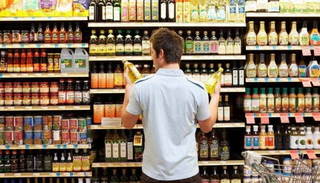 Man deciding between oils