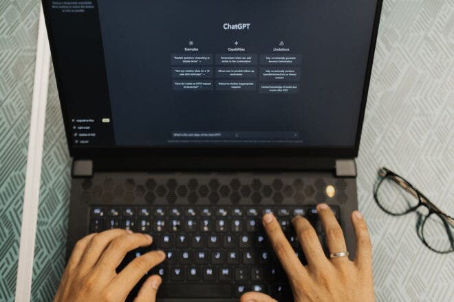 Person working with ChatGPT on laptop