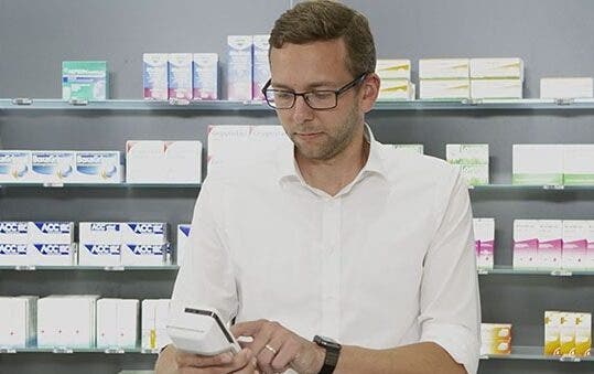 Man at pharmacy counter