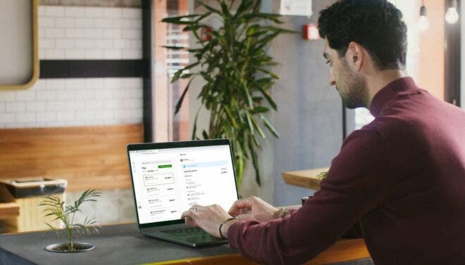 Man paying bills on laptop