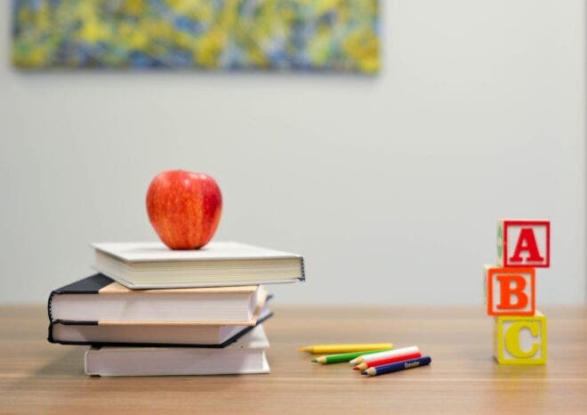 Apple books and blocks on desk