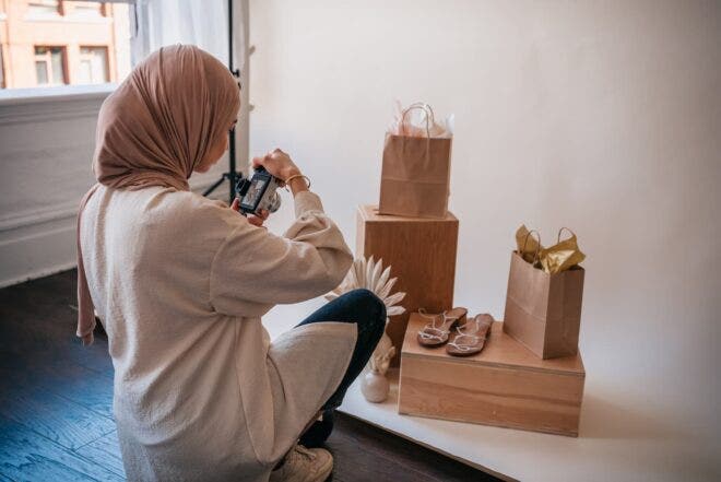 Woman taking pictures of shoes