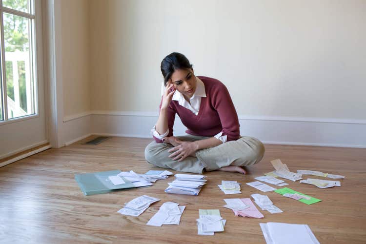 Woman looking at receipts