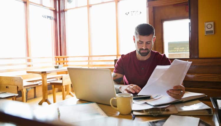 Restaurant owner looking at paperwork