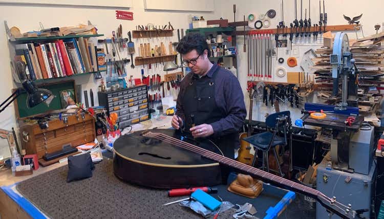 Patt at work, repairing and instrument