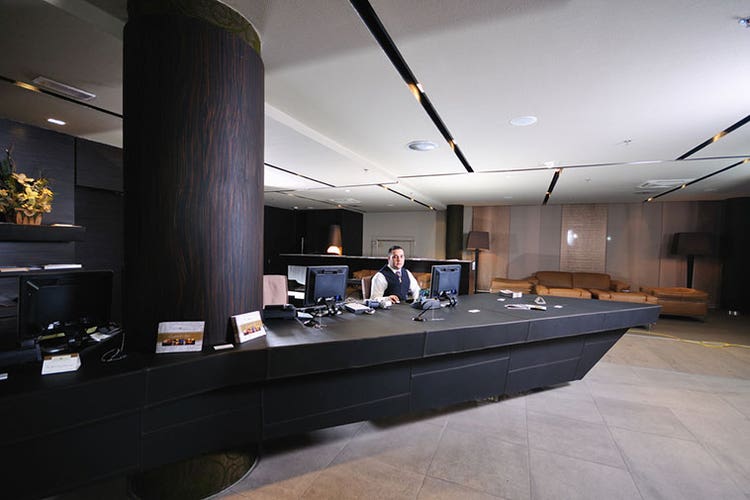 Man at hotel check-in desk