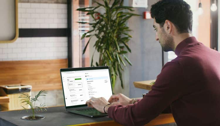 Man paying bills on laptop
