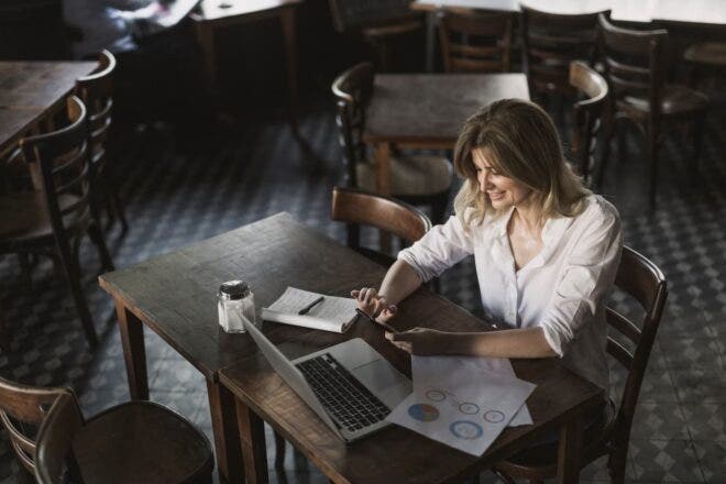 Restaurant manager reviewing reports