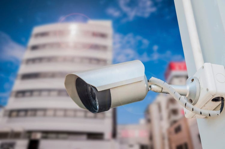 Security camera attached to a building
