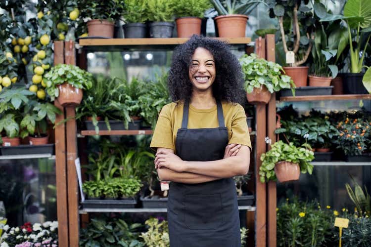 Woman in front of plants