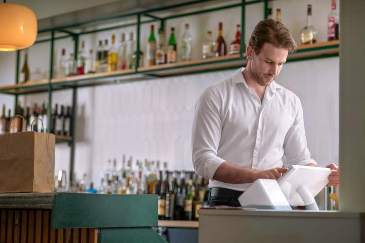 Bar manager looking at Clover Station Solo