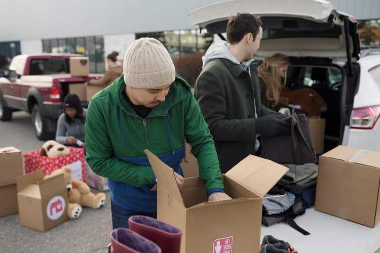 People packing boxes for clothing drive