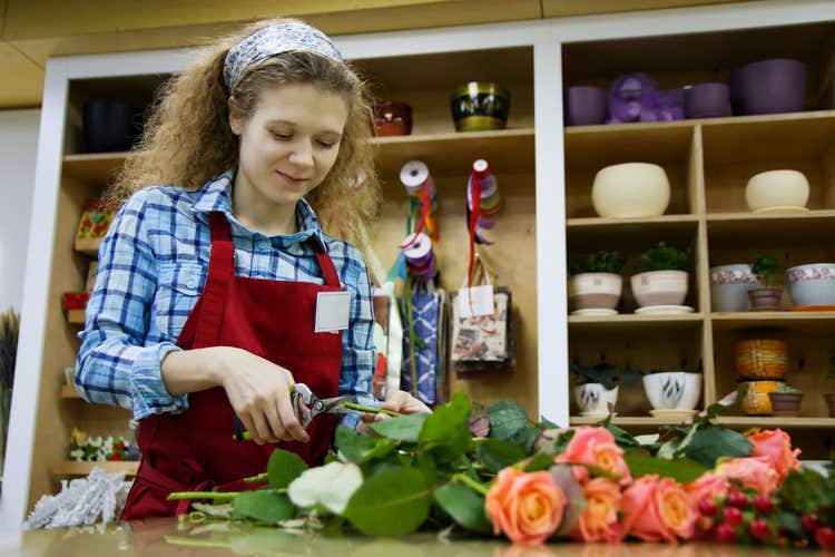 Florist assembling roses