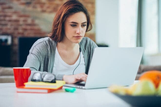 Woman looking at laptop