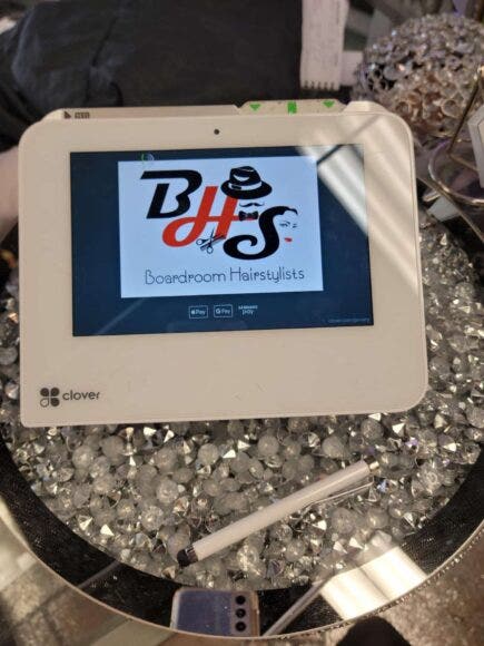Clover Mini device with Boardroom Hairstylists branding