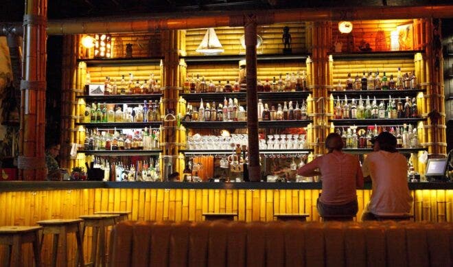 Two people sitting at a bar