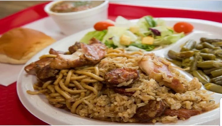 Plate of Jambalaya, salad, and green beans from The Jambalaya Shoppe Acadian