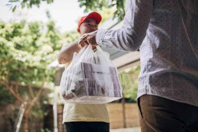 Man delivering food order to customer