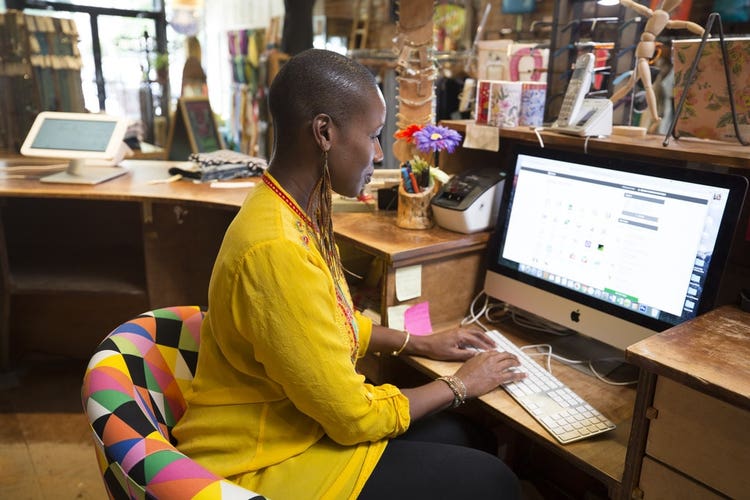 Boutique owner working on computer