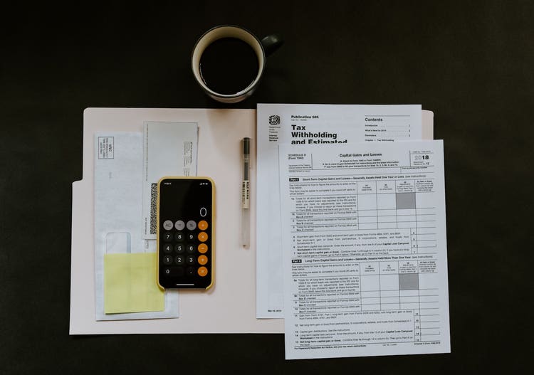 Folder with tax papers and calculator