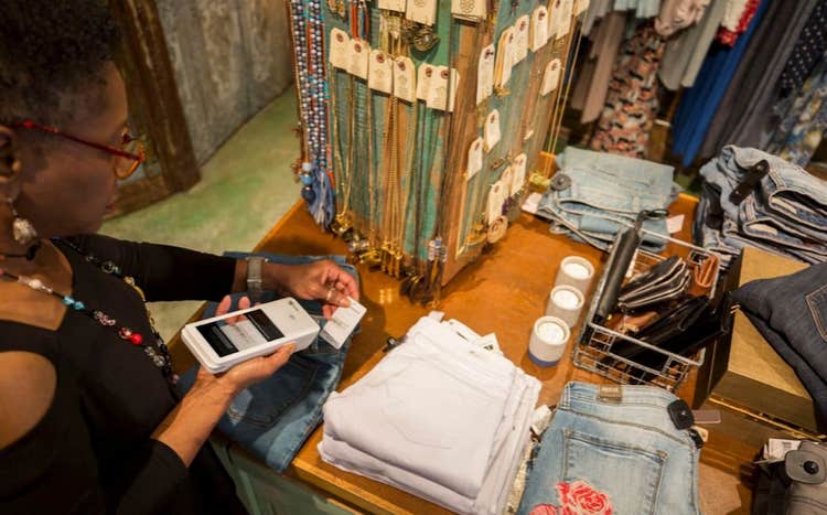 Woman scanning barcodes with Clover Flex