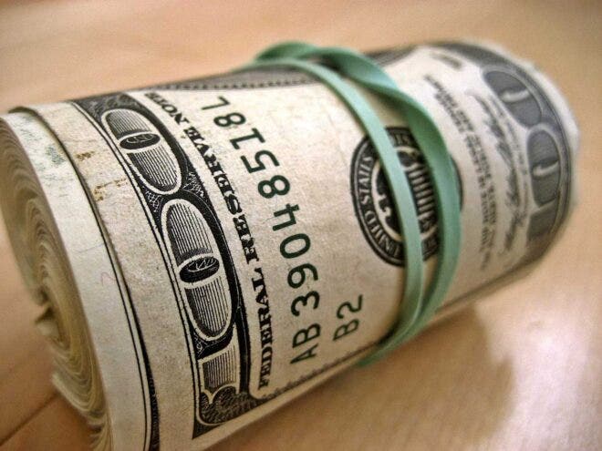 Roll of hundred dollar bills