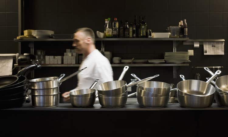 Chef walking through restaurant kitchen