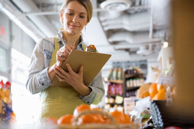 Woman holding clipboard