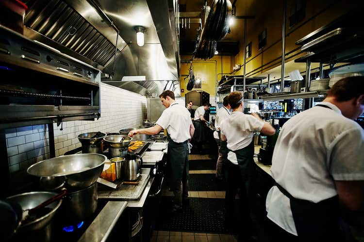 Staff cooking in restaurant commercial kitchen