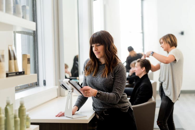 Staff and customers in hair salon