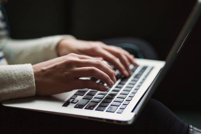 Hands typing on keyboard