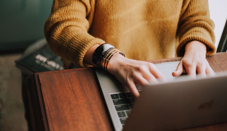 Person typing on laptop