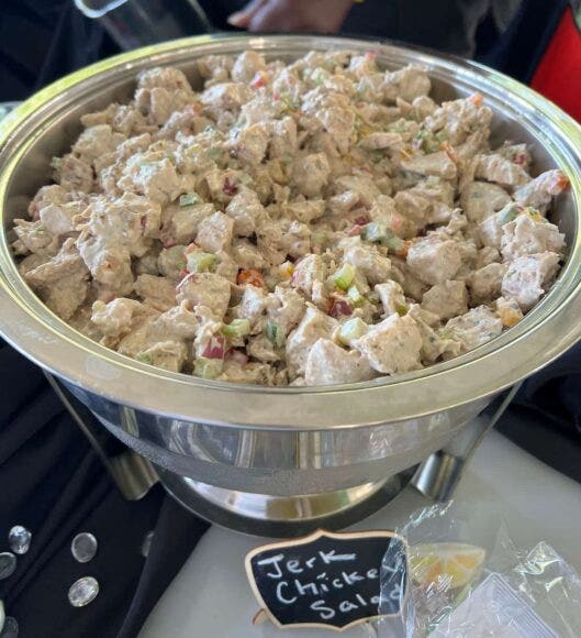 Jerk chicken salad in a serving bowl
