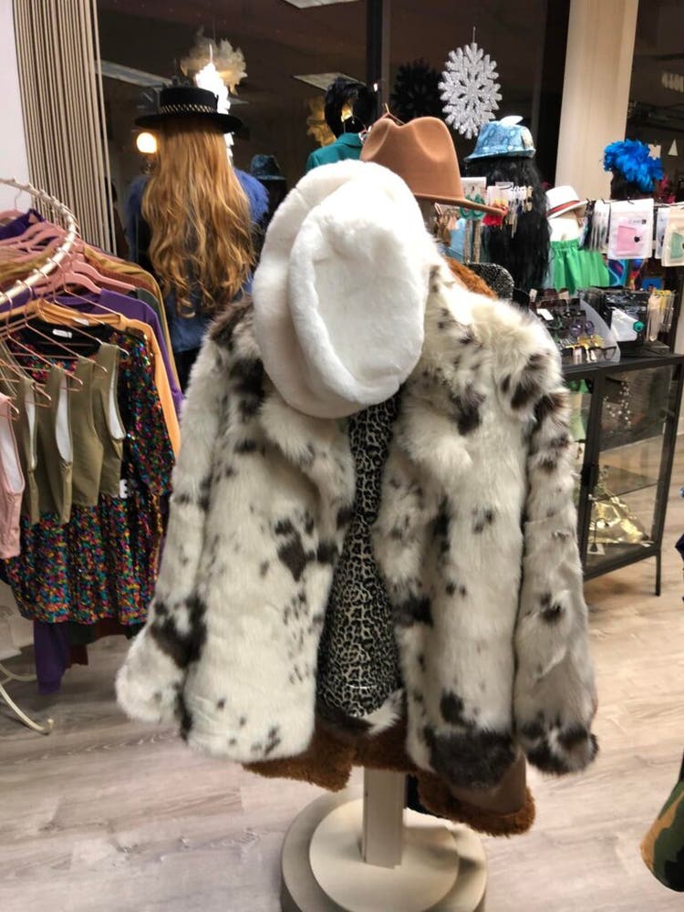 Animal print coat and blouse in boutique