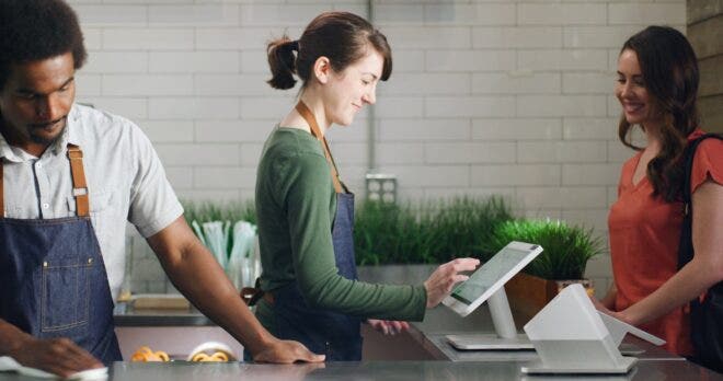 Woman using Clover Station POS