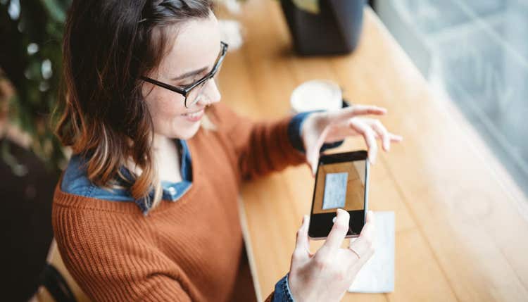 Woman making mobile deposit