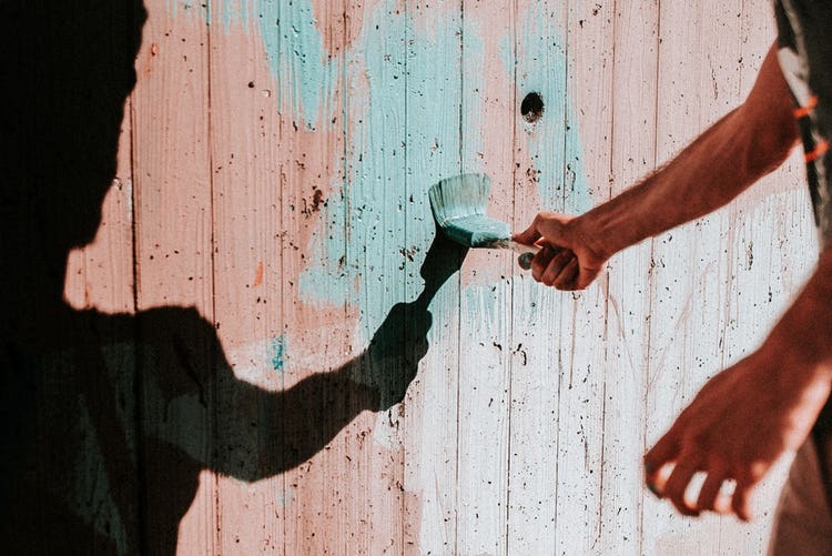 Painting a wooden fence