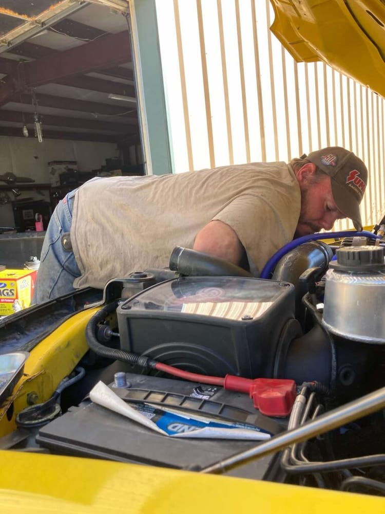 Owner of Boss Custom working on a vehicle