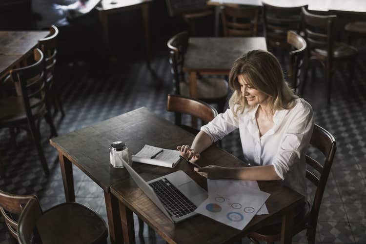 Restaurant manager reviewing reports